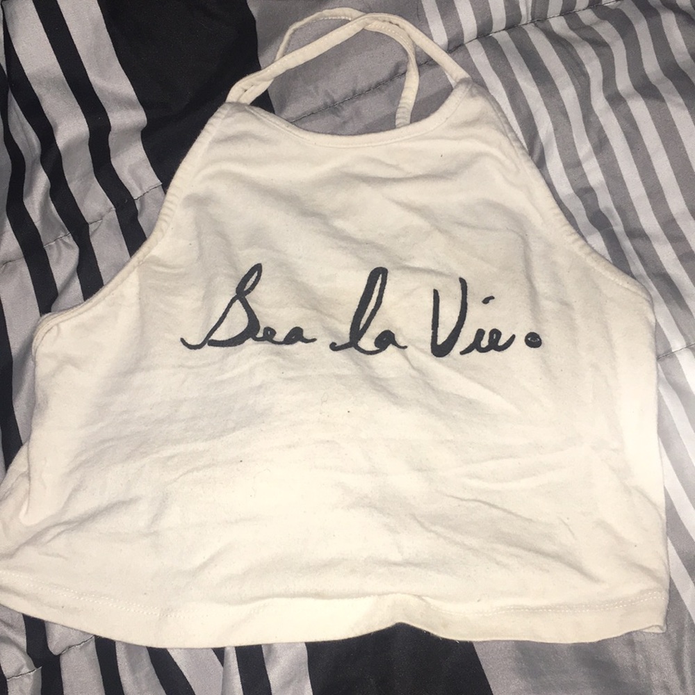 Crop top. “sea la vie.”  means the sea life.